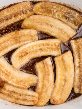 close up of banans in foster sauce in slow cooker.