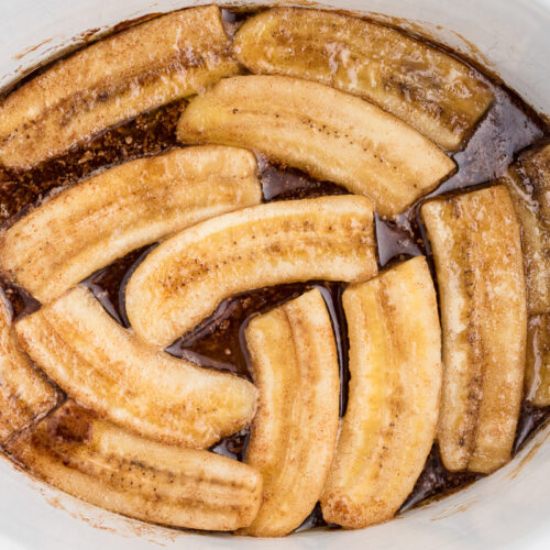 close up of banans in foster sauce in slow cooker.