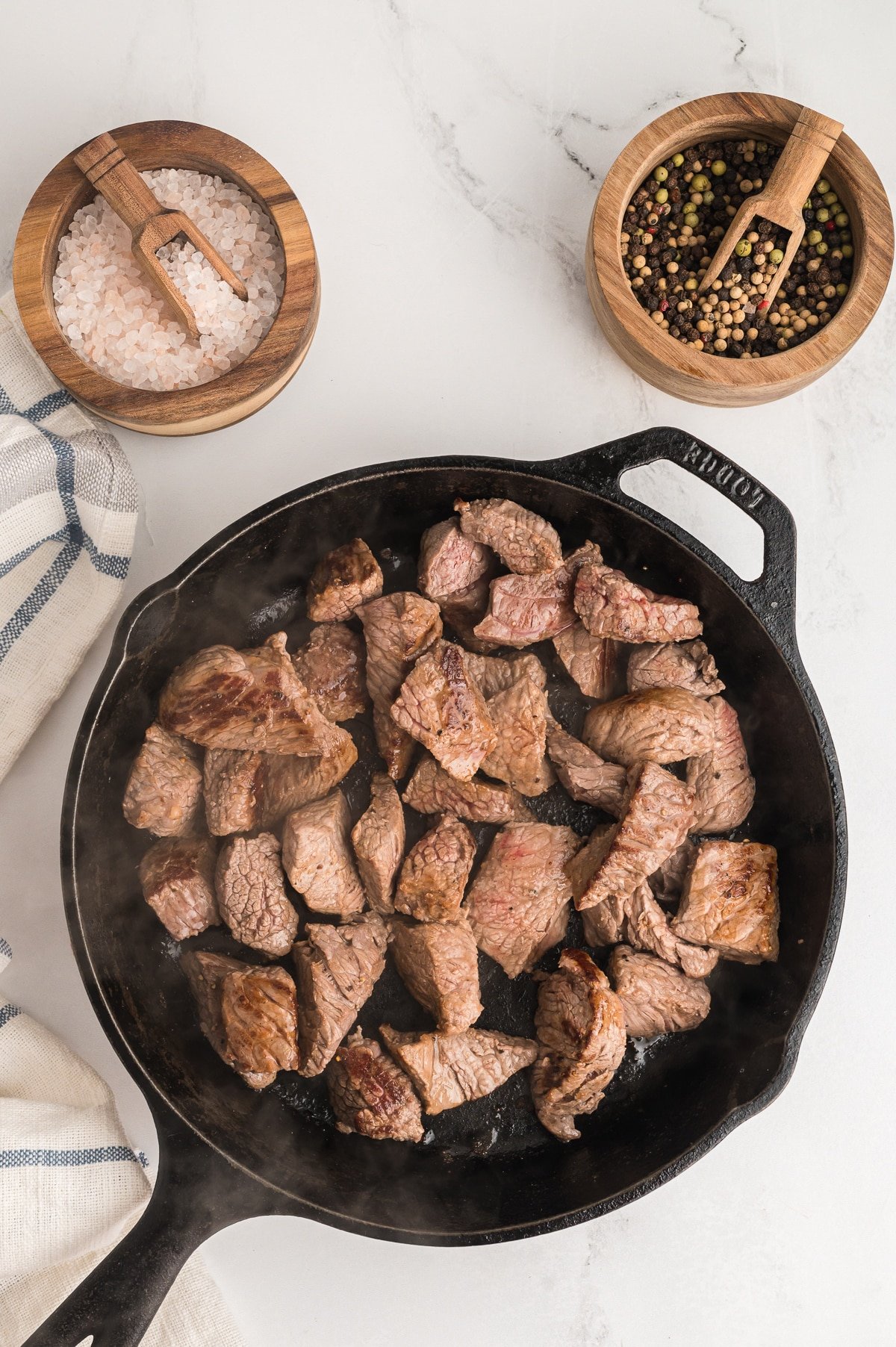 cooked stew meat in a skillet.