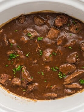 overhead shot of beef tips in slow cooker.