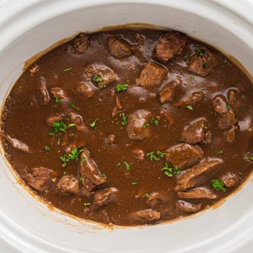 overhead shot of beef tips in slow cooker.