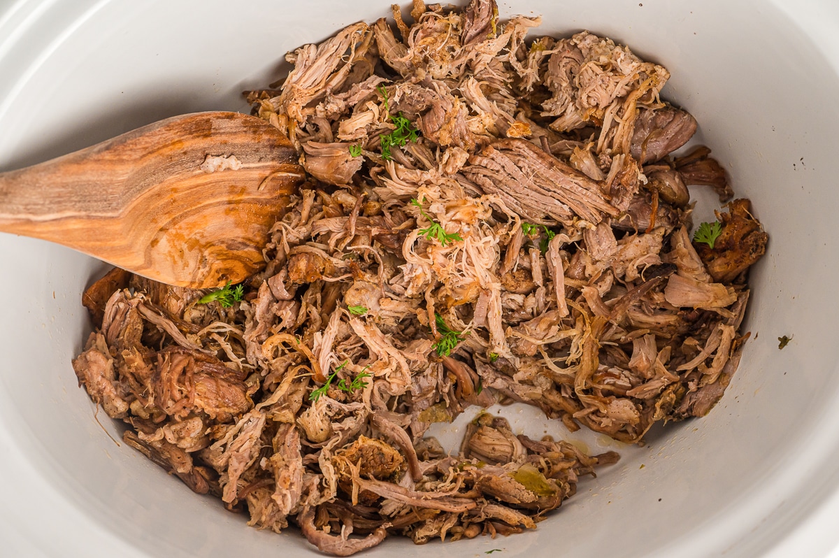 overhead shot of crispy carnitas in crockpot.