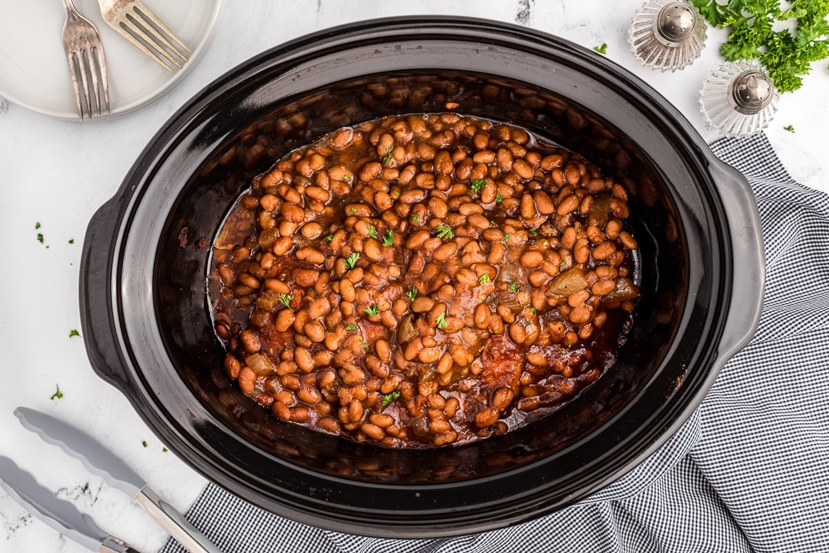 overhead shot of baked beans and country style ribs.