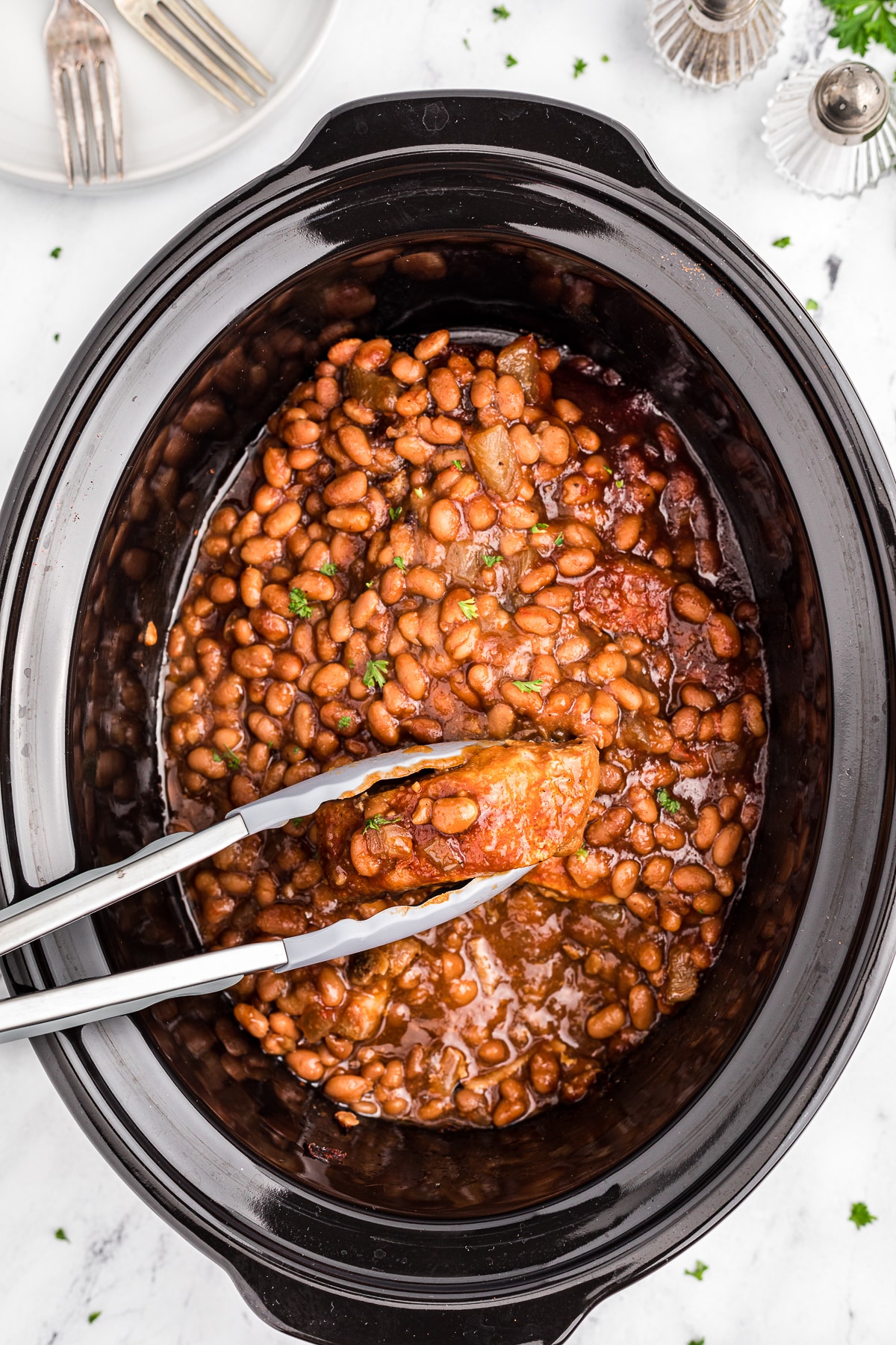 Baked beans with cooked country style ribs.