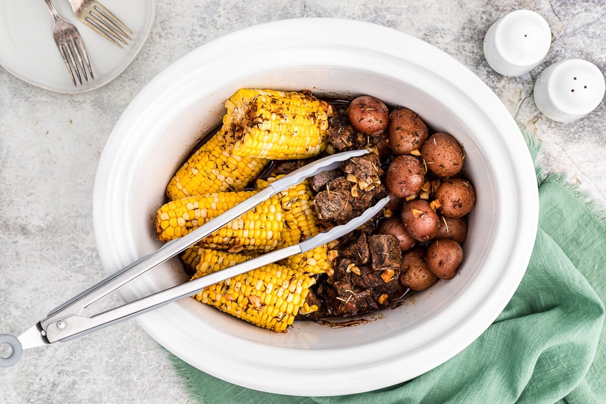 done cooking steak, corn and potatoes in crockpot.