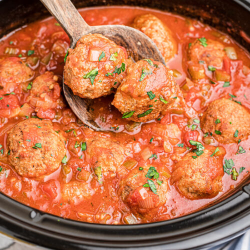 side view of turkey meatballs in crockpot.