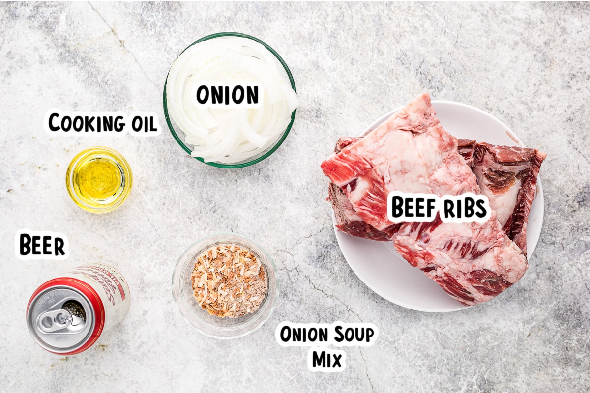 Ingredients for beef and beer ribs on a table.