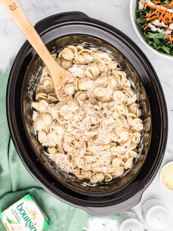 Crockpot full of chicken pasta with boursin cheese.