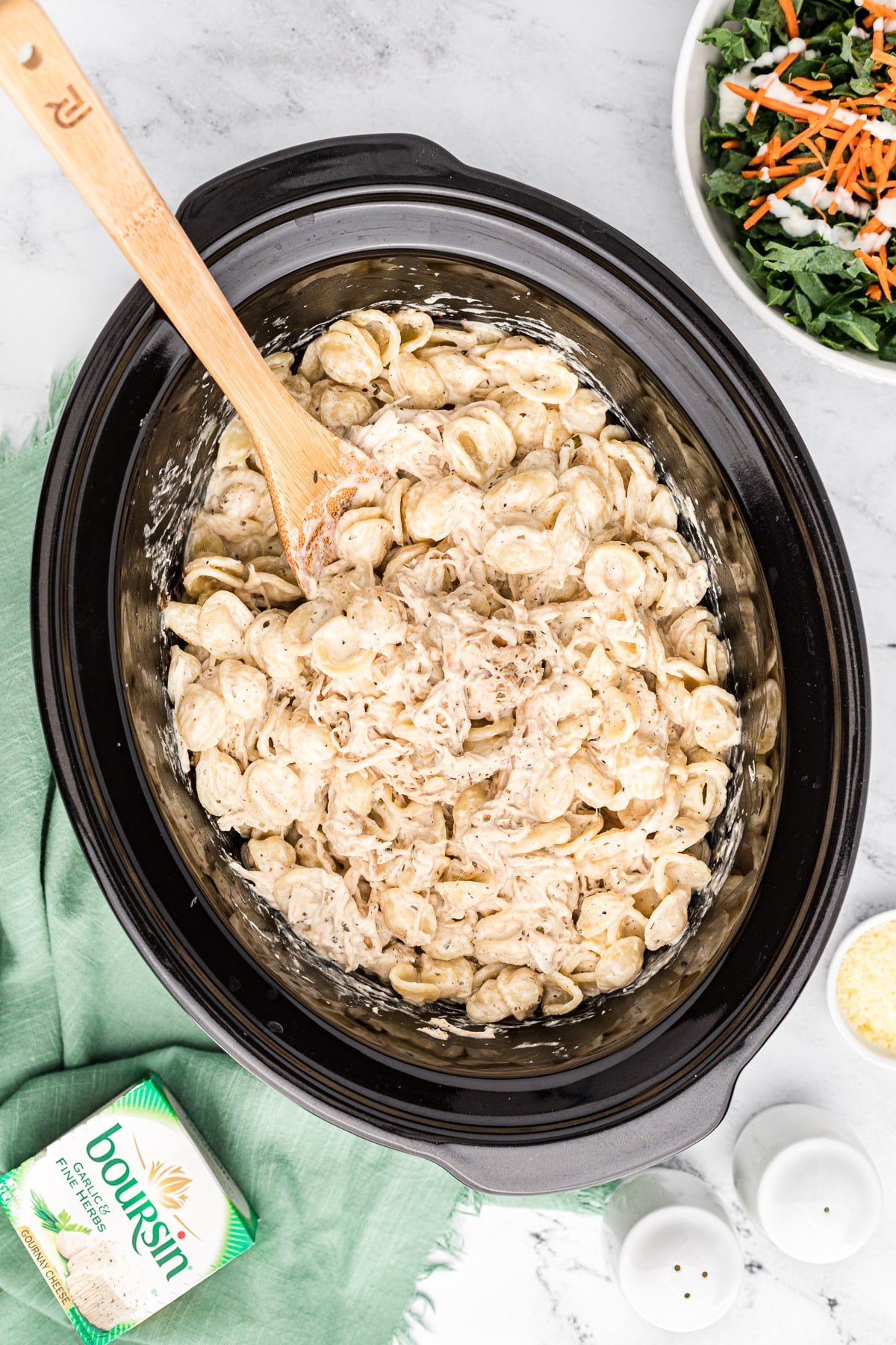 Crockpot full of chicken pasta with boursin cheese.