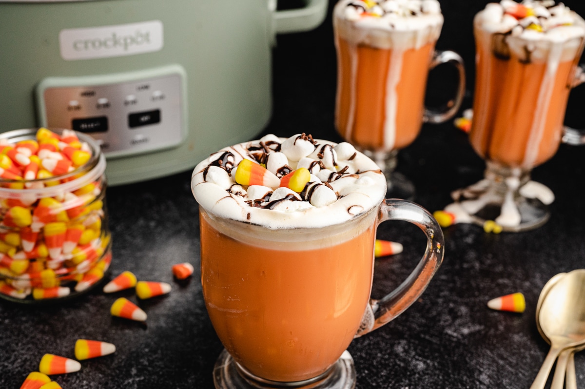 candy corn hot chocolate in a mug.