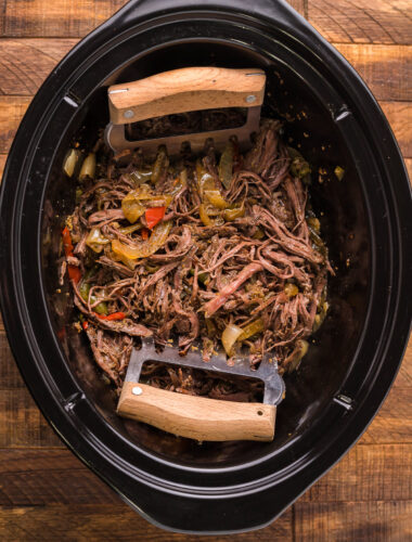 cooked carne asada in slow cooker.