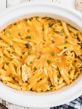 overhead image of cooked chicken penne with cheese.