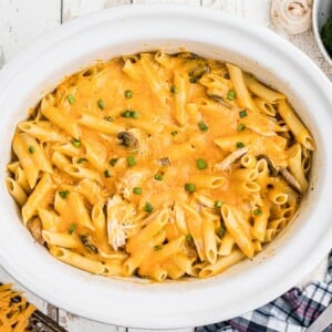 overhead image of cooked chicken penne with cheese.