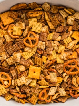 Overhead shot of chex mix in a slow cooker.