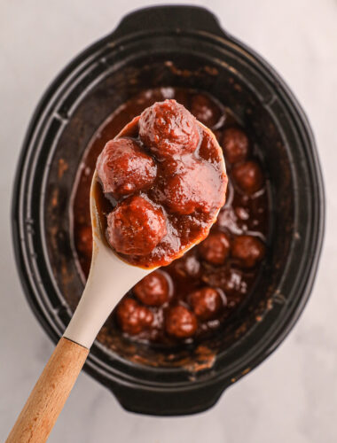 cranberry meatballs on a spoon.
