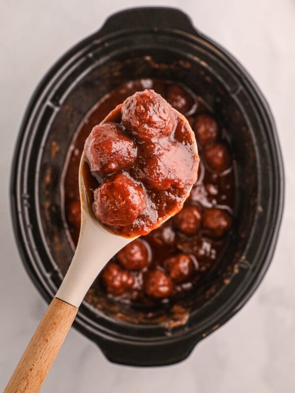 cranberry meatballs on a spoon.