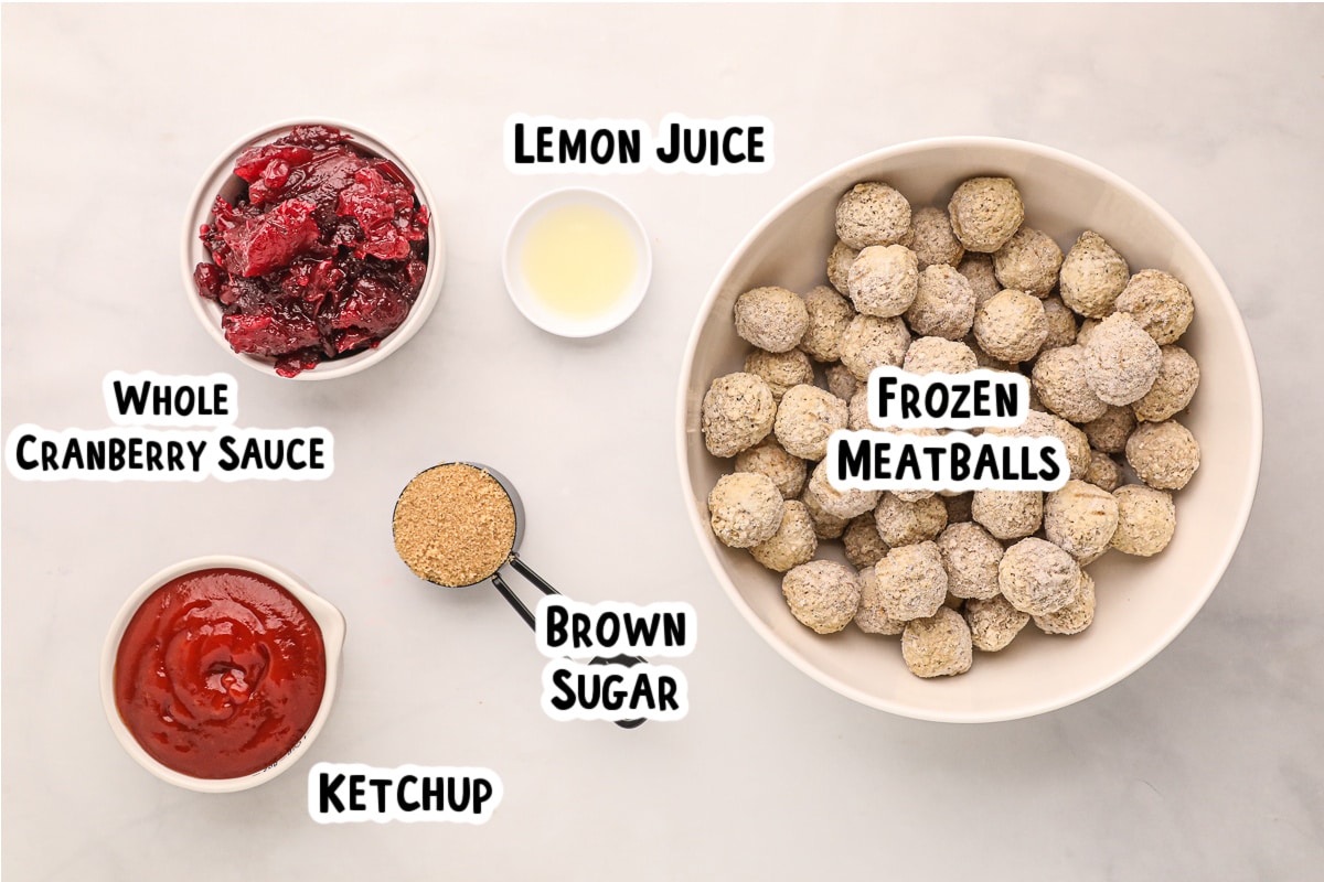 Ingredients for cranberry meatballs on a table.