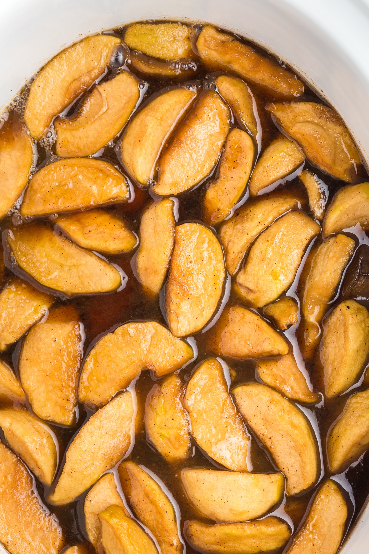 Apple cooked in slow cooker fireball and homemade caramel sauce.