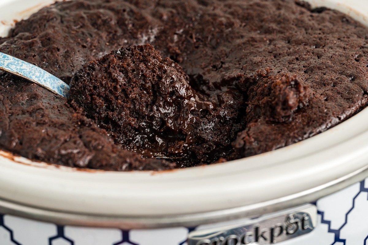 Close up of hot fudge cake with spoon in it.