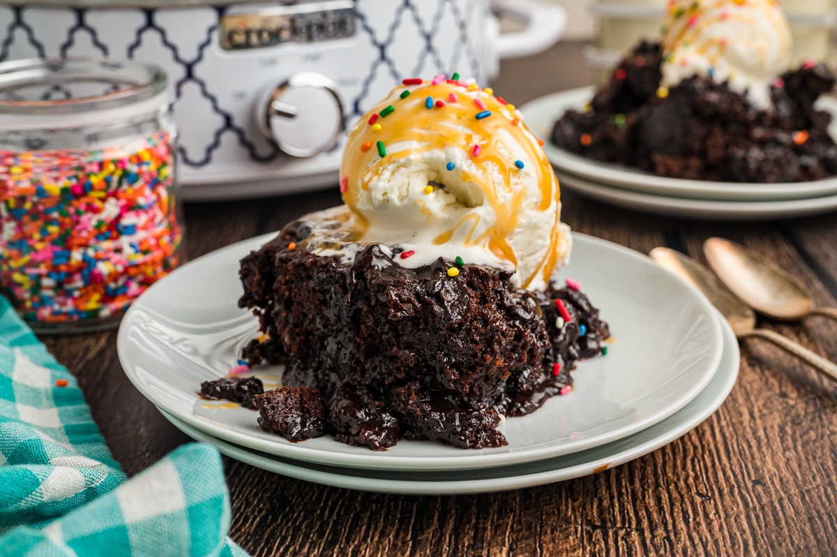 Hot fudge cake with ice cream, caramel and rainbow sprinkles.