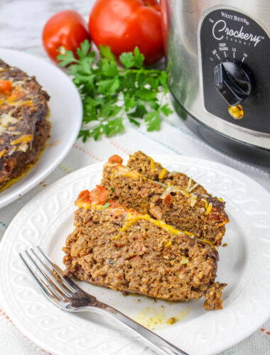 2 slices of meatloaf on a plate.