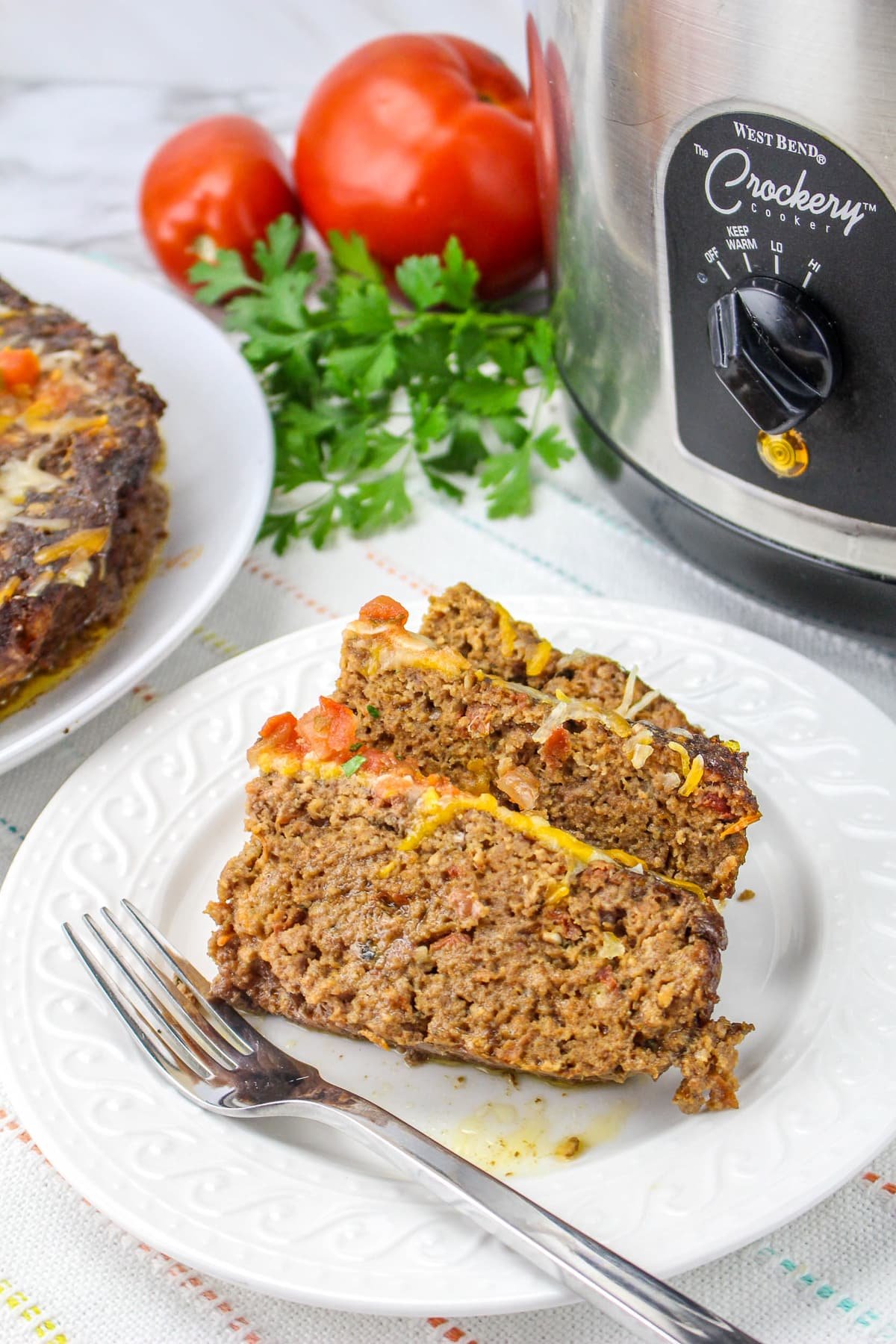 2 slices of meatloaf on a plate.