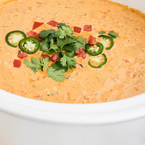 Side view of smoked queso in a crockpot.