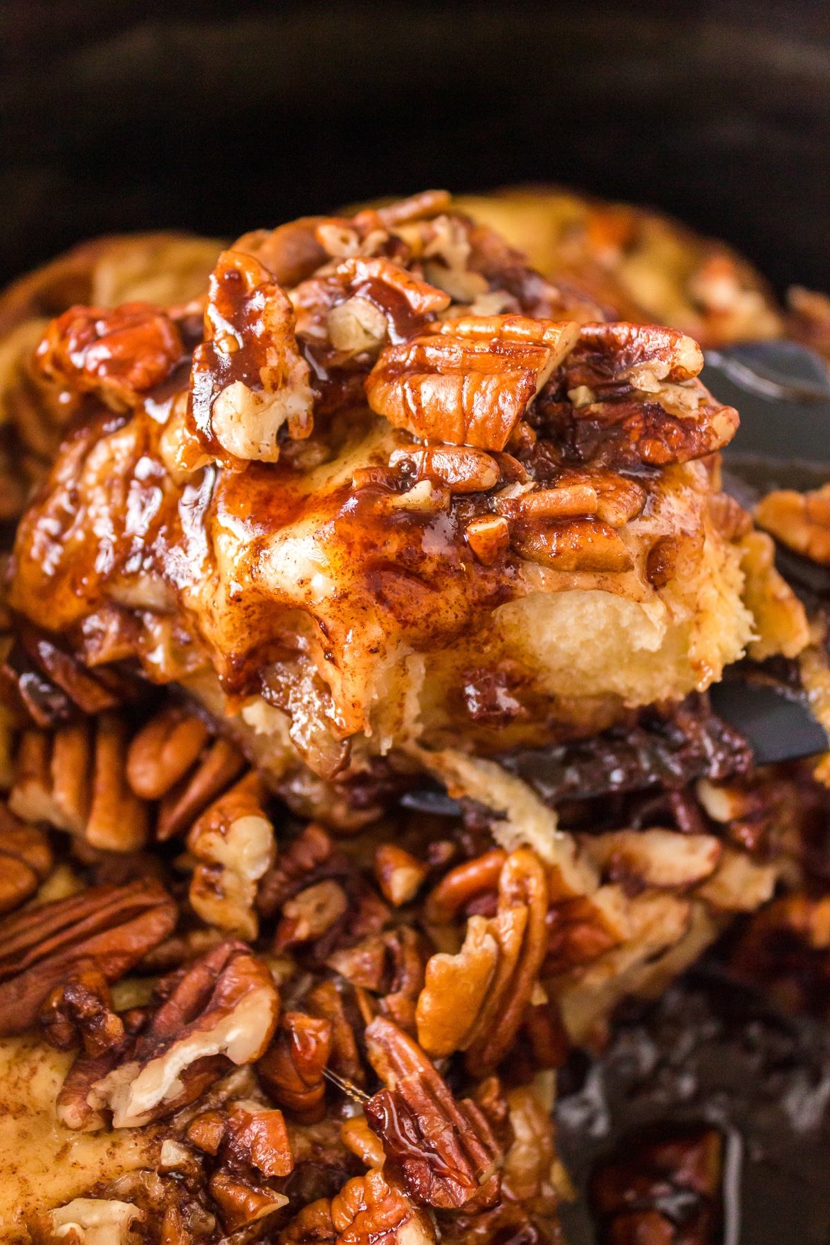 A sticky bun on a spatula.