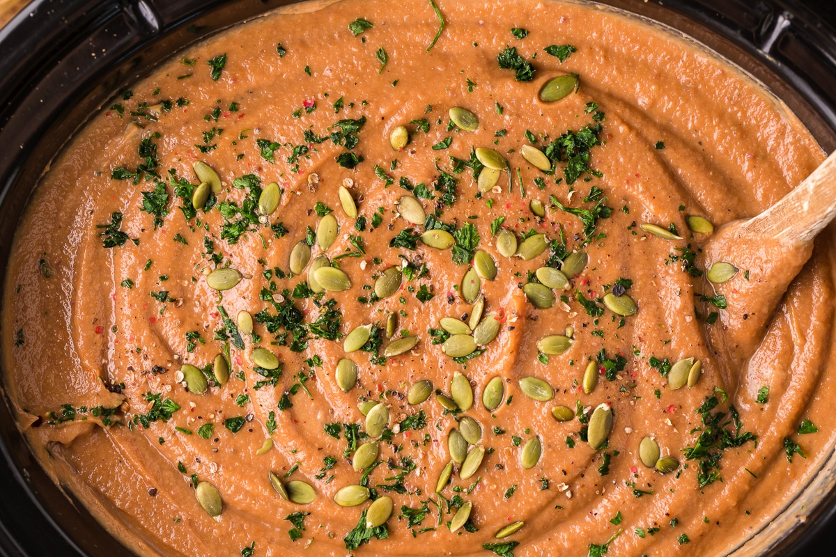 overhead shot of pumpkin soup in crockpot.