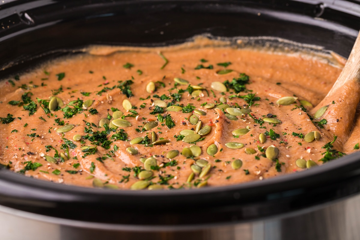 side view of sweet potato soup in the crockpot.