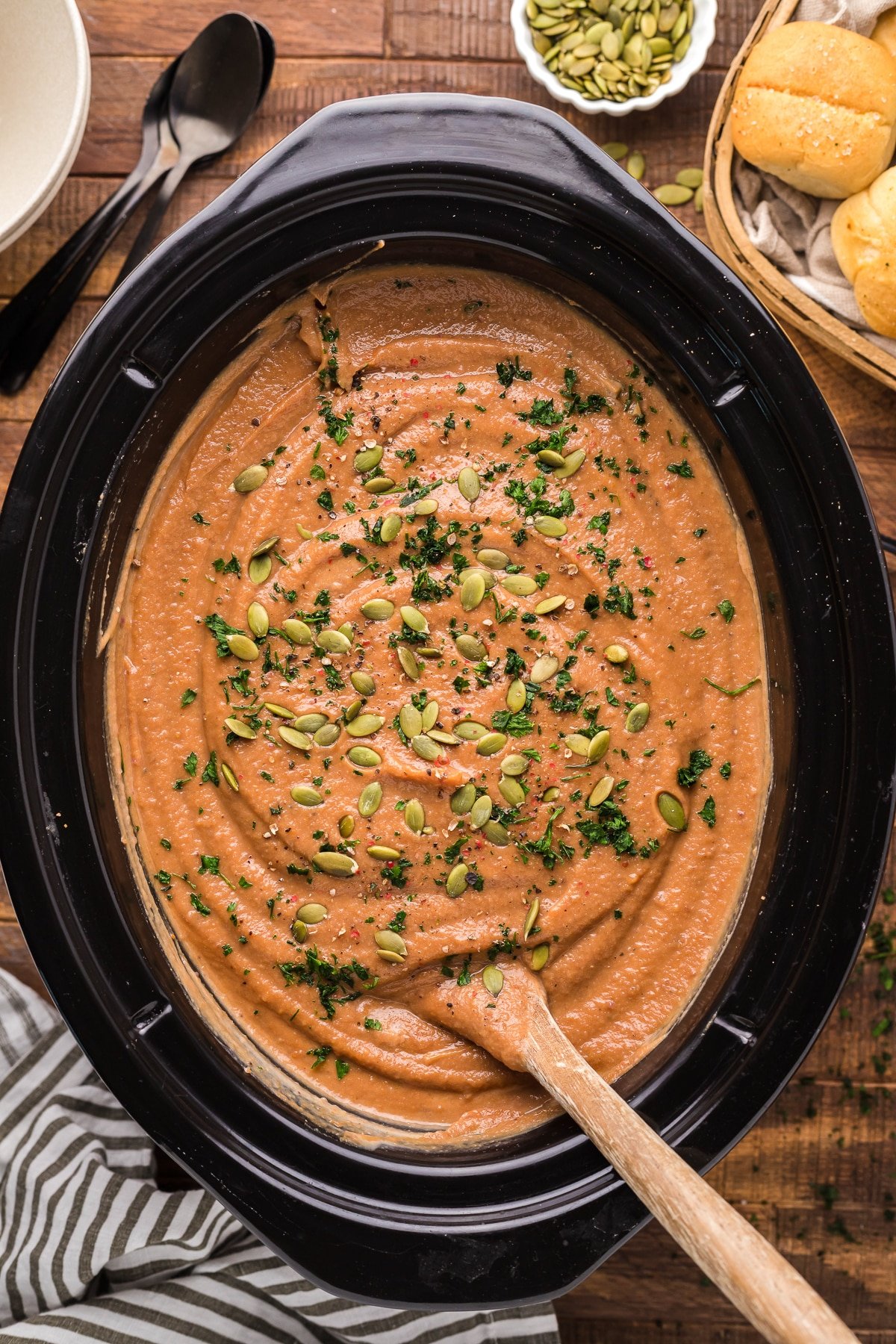 sweet potatoes and cauliflower soup with pumpkin seeds on top.