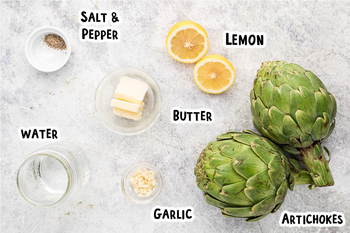 ingredients for artichokes on a table.