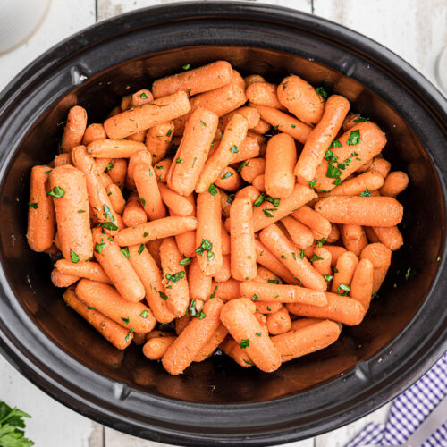 Baby carrots in slow cooker with butter and parsely.