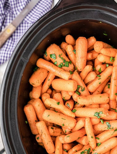 close up of baby carrots in the slow cooker.