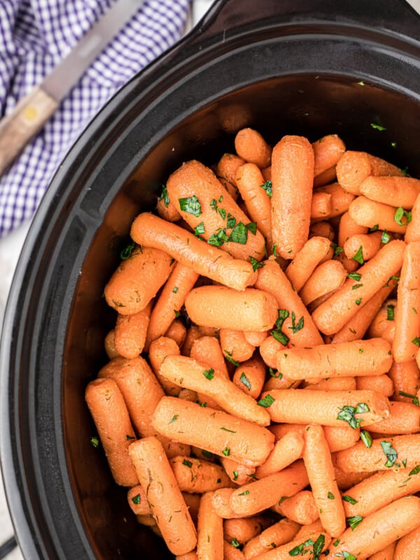 close up of baby carrots in the slow cooker.