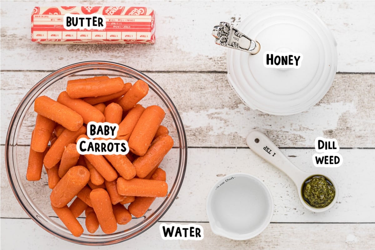 Ingredients for baby carrots on a table.