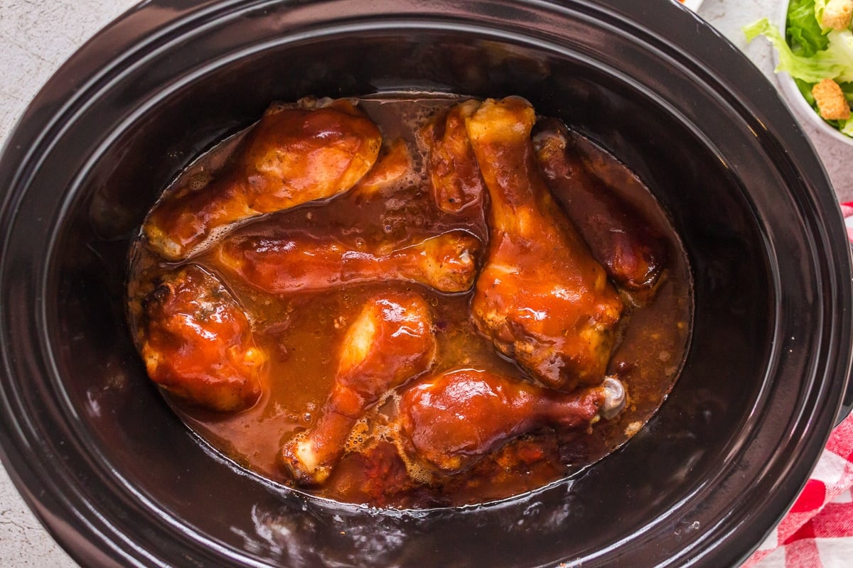 overhead shot of bbq drumsticks in crockpot.