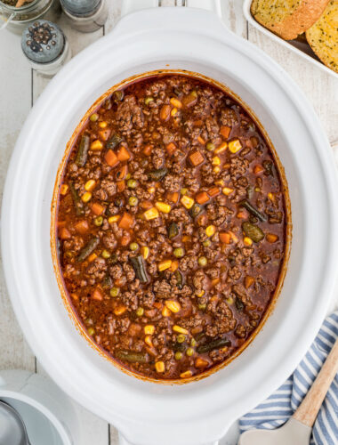 Overhead shot of cooked hamburger soup in crockpot.