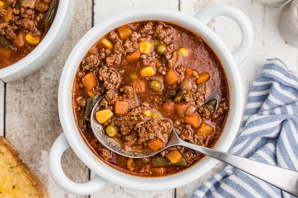 bowl of soup with spoon in it.