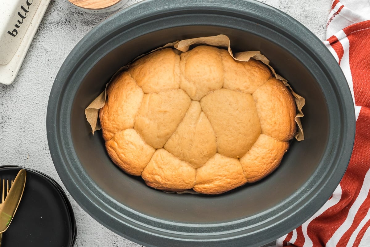 Cooked rolls in a crockpot.
