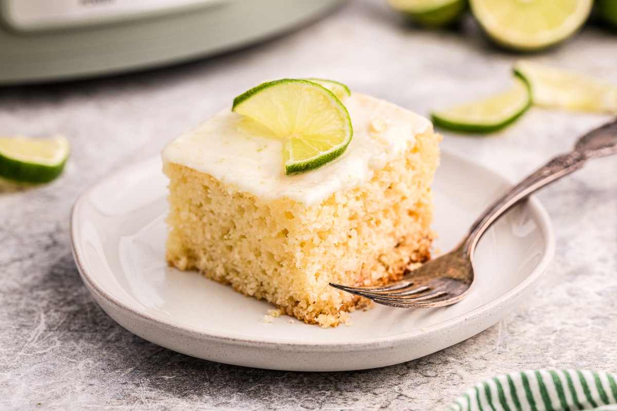 slice of key lime cake on a plate.