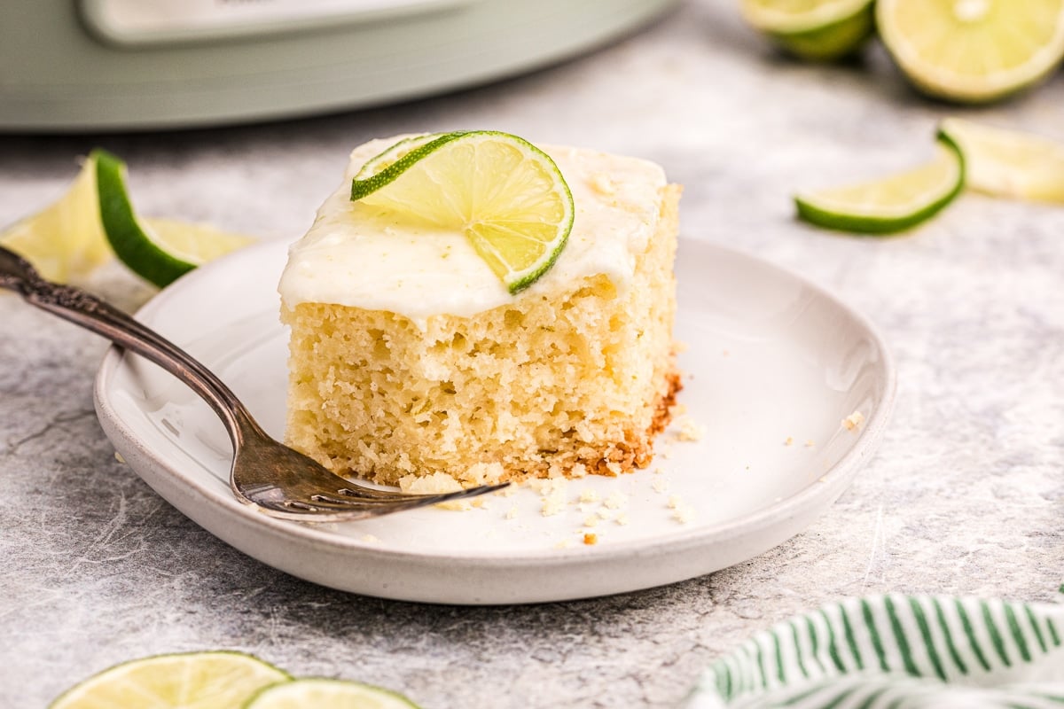 key lime cake with bite out of it.