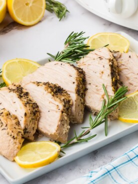 tray of turkey breast with lemon.