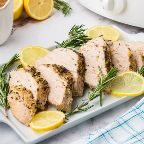 tray of turkey breast with lemon.