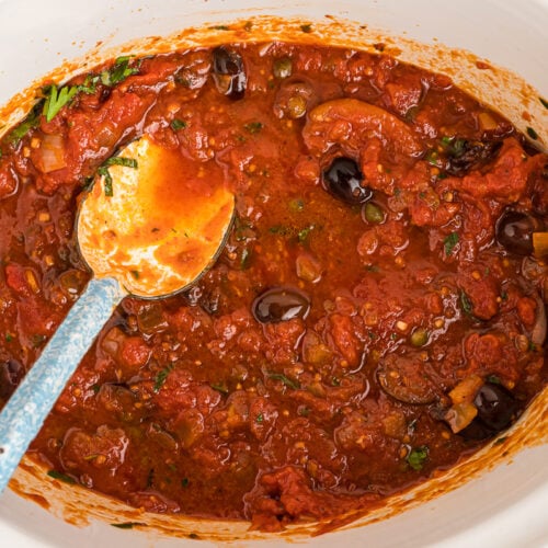 Overhead shot of puttanesca sauce in the crockpot.