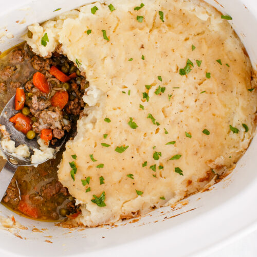 close up of shepherd's pie with scoops out.