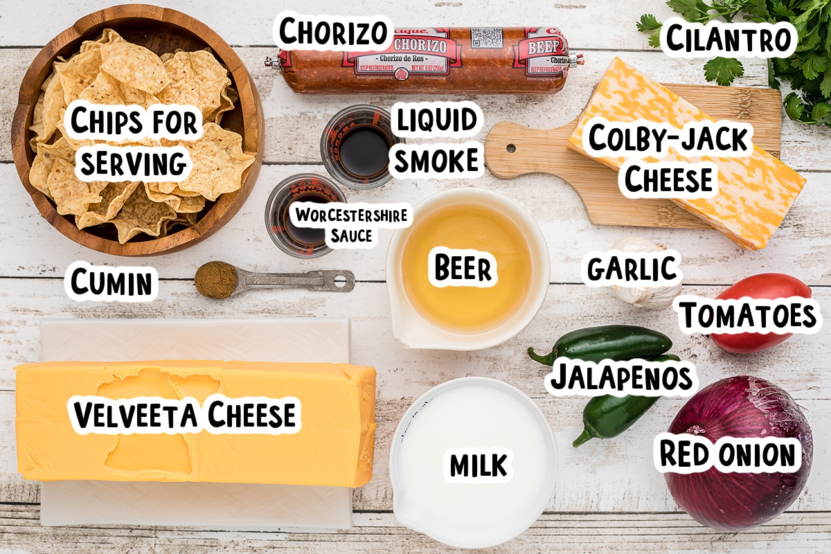 ingredients for smoked queso with text labels on a table.