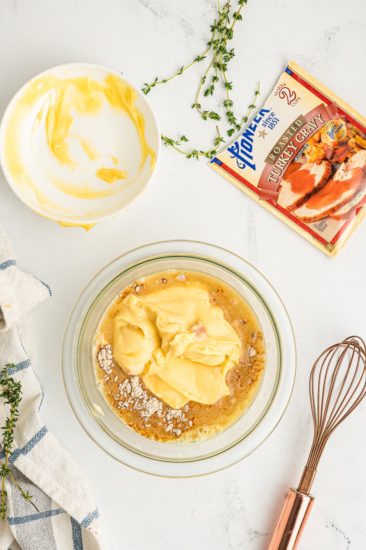 cream of chicken soup, chicken gravy and broth in a bowl.