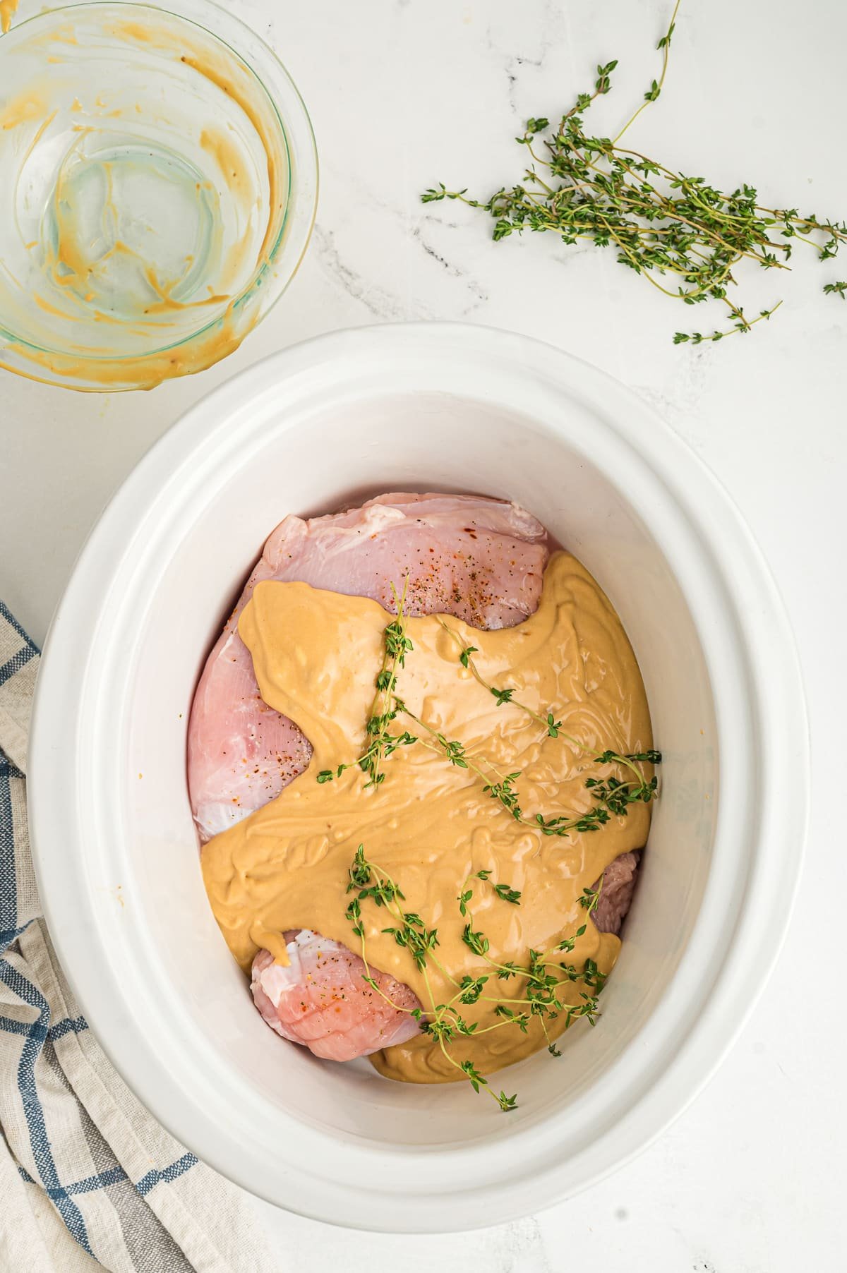 gravy mixture over turkey in a slow cooker.