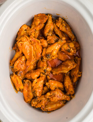 cooked buffalo wings in the crockpot.